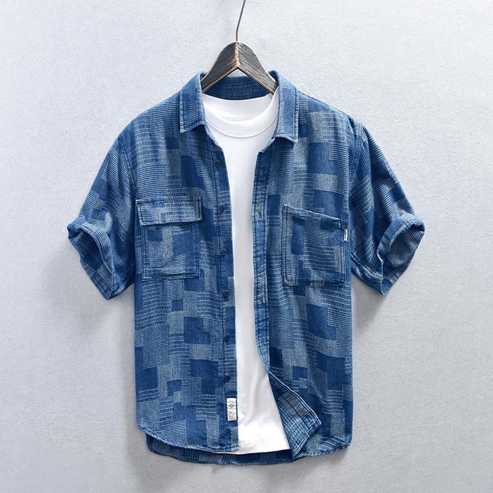 Men's casual blue denim shirt, long sleeve, button-up, relaxed fit for stylish everyday wear.