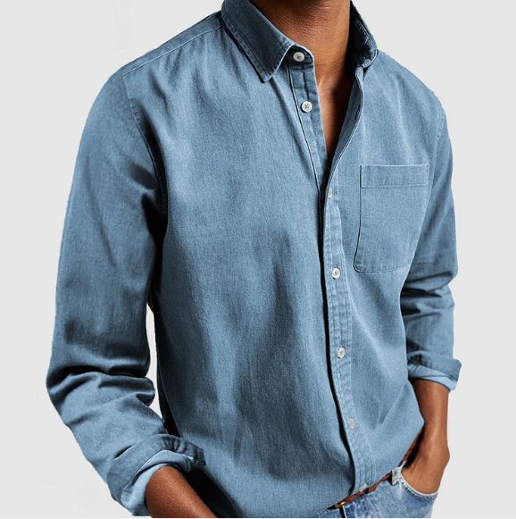 Men's classic denim button-up shirt cuff detail, showing buttons & precision stitching for a polished look.