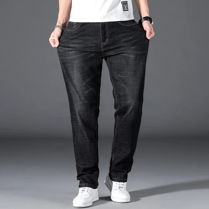 Versatile men's straight leg blue jeans with a classic, relaxed fit, perfect for durable everyday fashion.