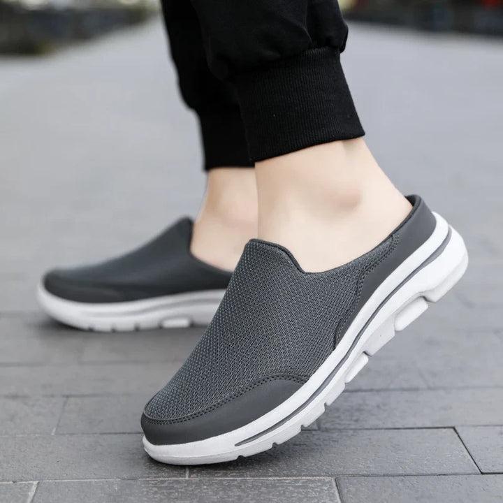 Comfort-focused men's slip-on mules, closed-toe design, durable casual sandals.