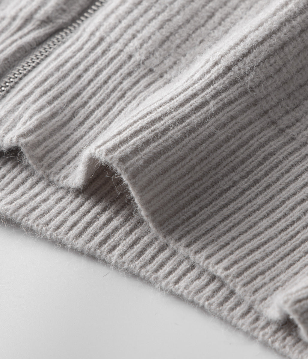 Detail shot: funnel neck and full zip on a men's smart casual layering sweater.