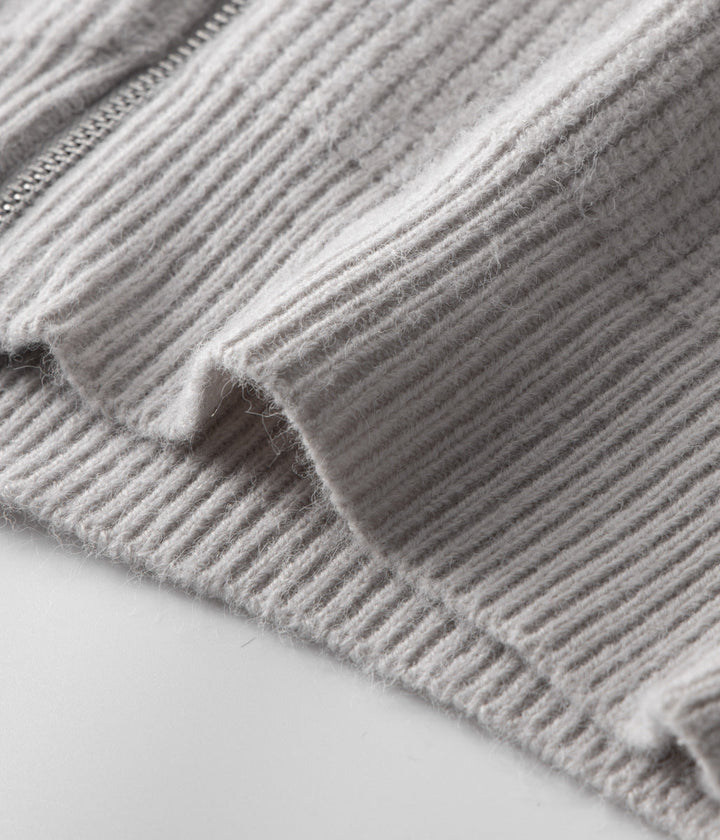 Detail shot: funnel neck and full zip on a men's smart casual layering sweater.