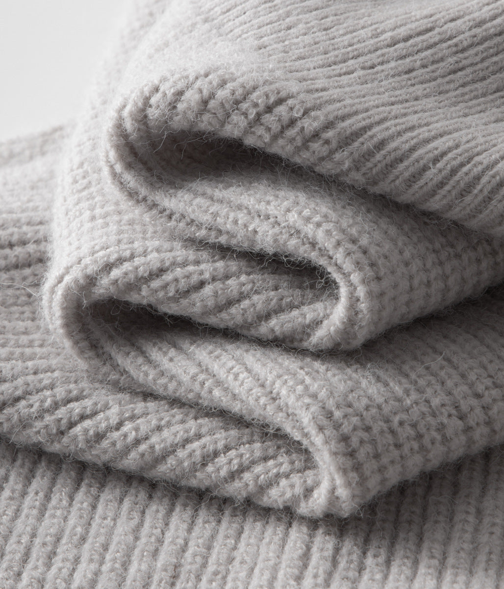 Man in a smart casual outfit, featuring a modern men's funnel neck zip-up sweater for layering.