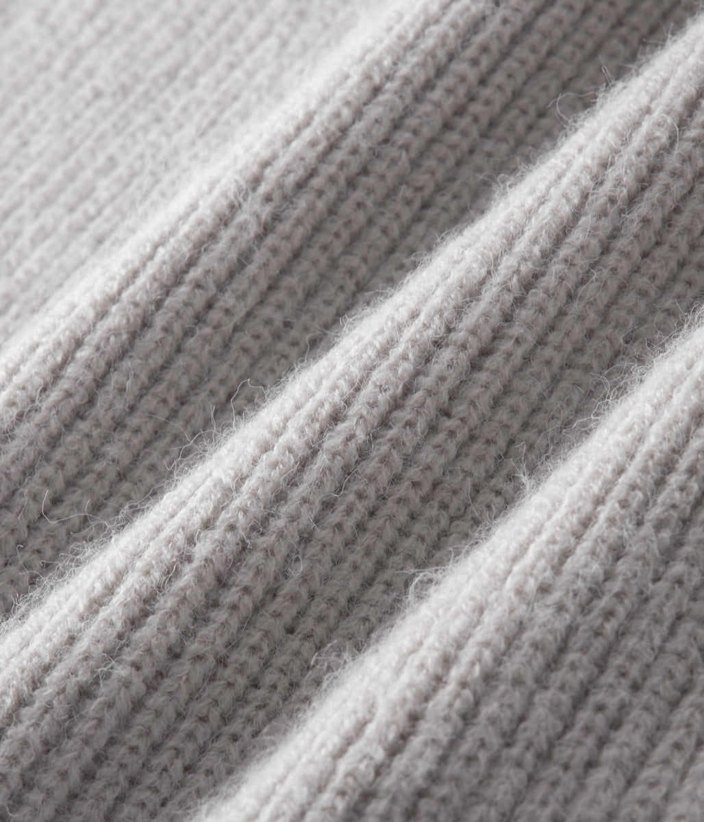 Back view of a men's funnel neck zip-up sweater, showing clean lines. Ideal for versatile layering.