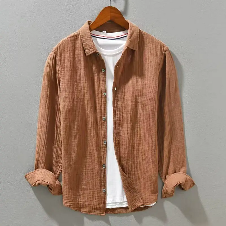 Relaxed fit men's lightweight button-up shirt, breathable for casual everyday wear and comfort.