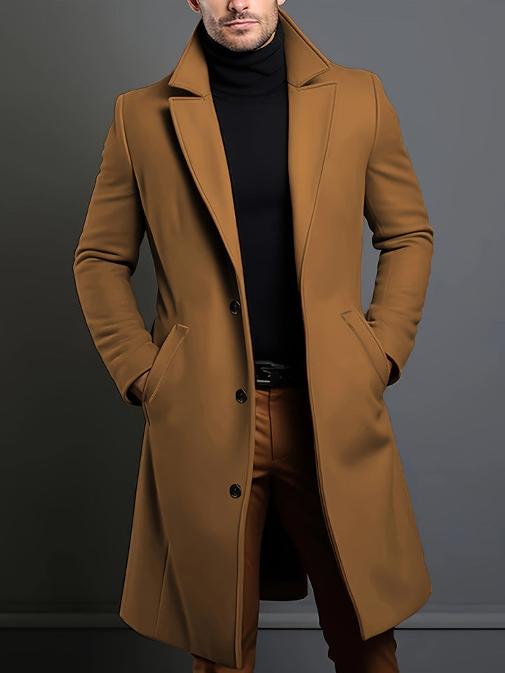 Men's long single-breasted lapel overcoat in classic dark blue, perfect for winter formal wear.