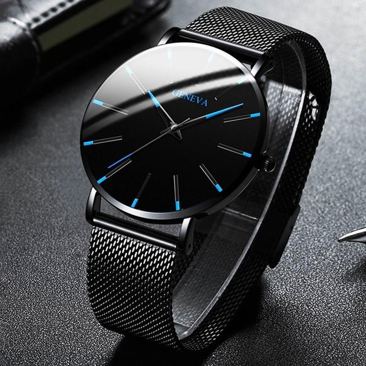 Fashionable men's everyday watch with a minimalist design, subtle blue dial accents & a versatile black strap.