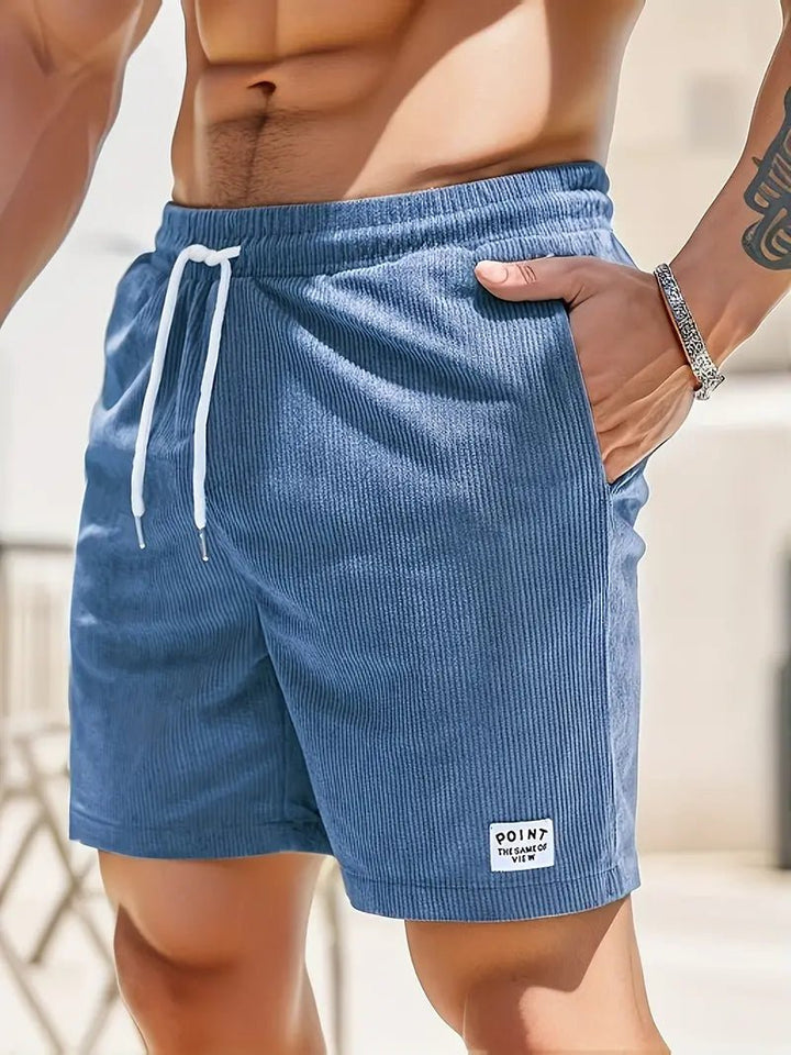 Comfortable men's elastic waist swim shorts, quick-dry fabric for pool and beach days.