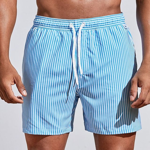 Close-up of men's striped swim shorts, highlighting the adjustable drawstring for a comfortable, secure fit.
