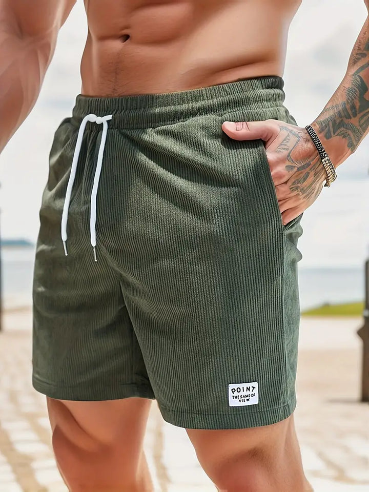 Men's ribbed summer shorts with drawstring & pockets, ideal for casual wear & beach vacations.