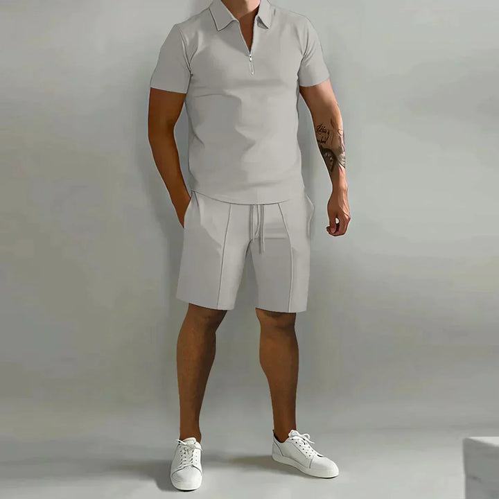 Stylish men's 2-piece summer outfit: zip polo & drawstring shorts. Perfect for casual wear.