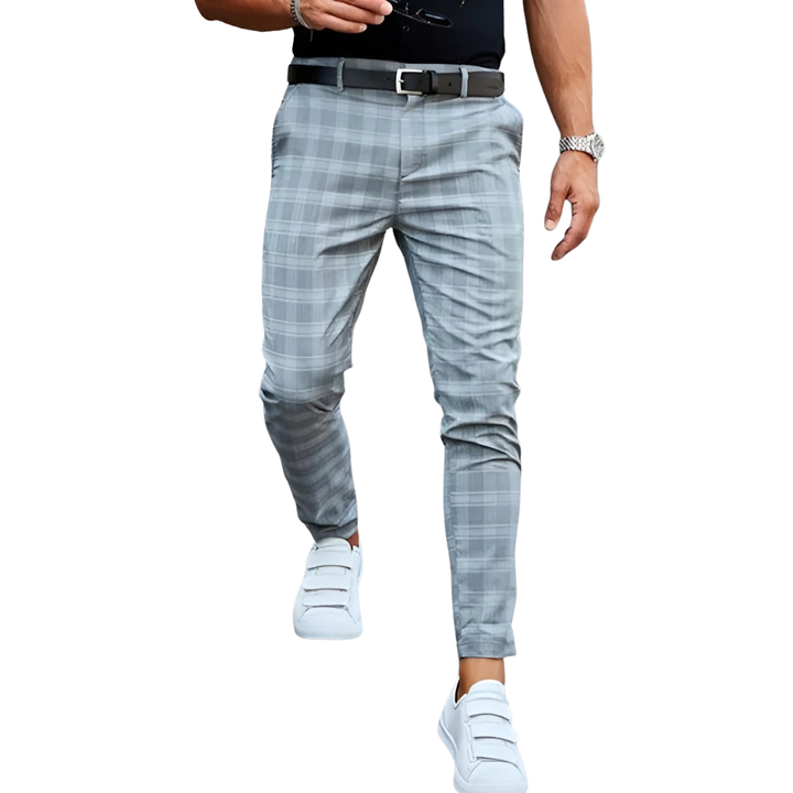 Stylish men's cropped checked trousers with a slim fit and tapered leg for modern everyday fashion.