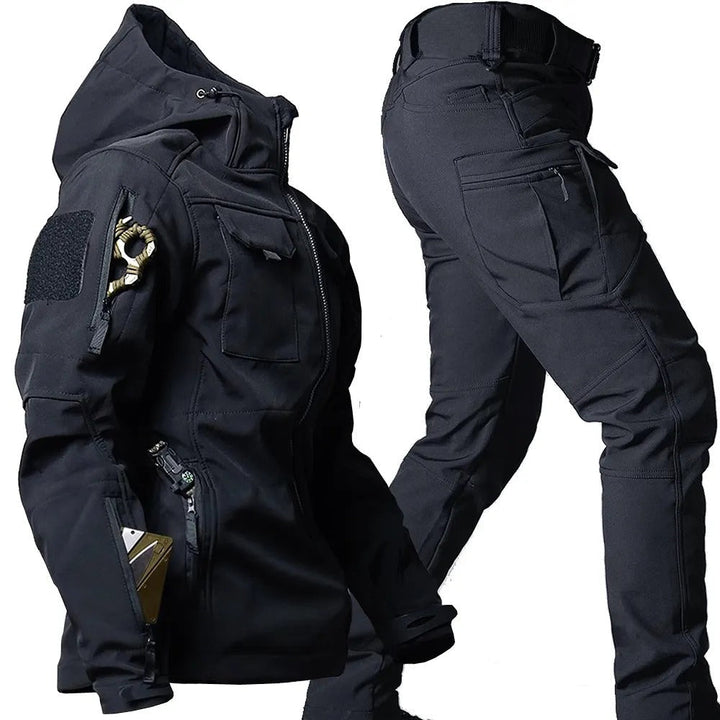 Black men's waterproof outdoor jacket and pants set for hiking, trekking & all-weather adventures.