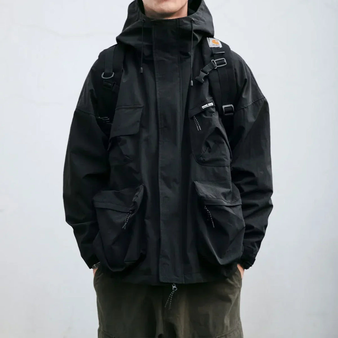 Lightweight men's hooded windbreaker jacket with multiple pockets, great for casual spring wear & outdoor activities.