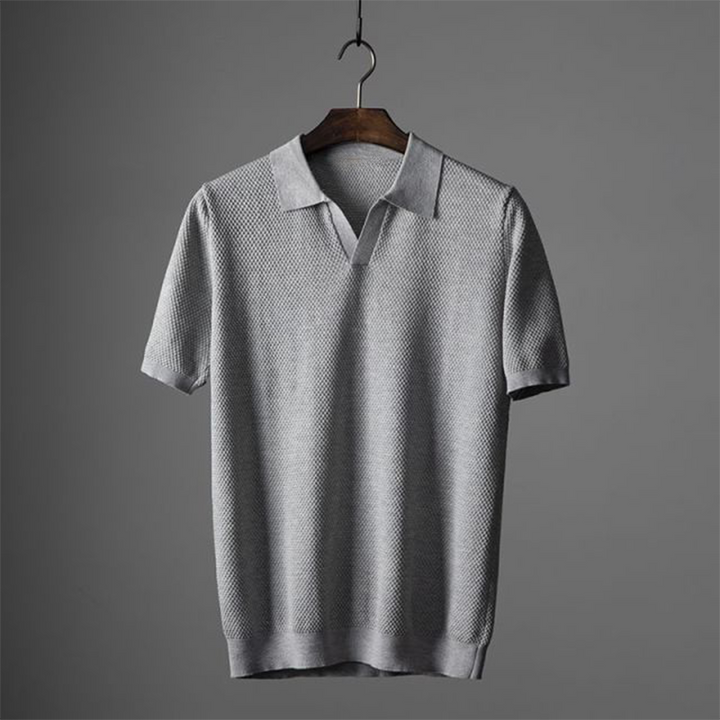 Comfortable men's collared polo with geometric textured pattern, perfect for summer wear.