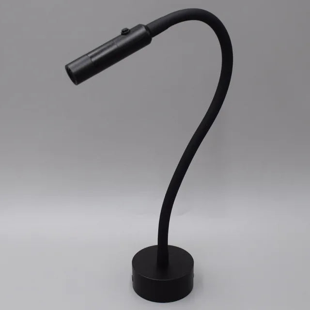 Minimalistische Lese-Wandleuchte mit flexiblem Arm, LED-Technologie, in Schwarz oder Weiß. Ideal zum Lesen, energiesparend.