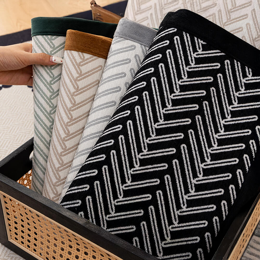 Angled view of a stylish chenille couch cover, herringbone design, offering furniture protection