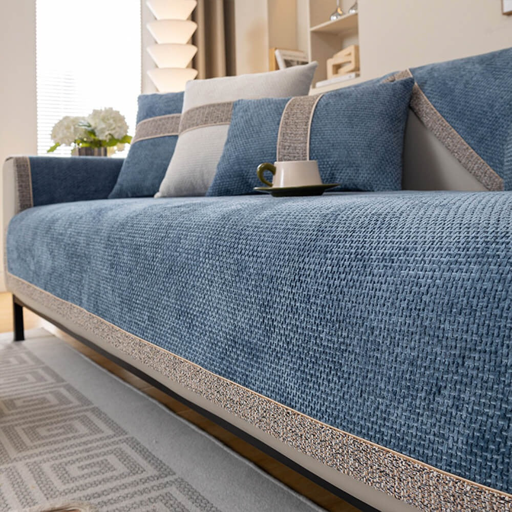 Full view of a living room with a modern tweed chenille sofa cover, pet and kid-friendly