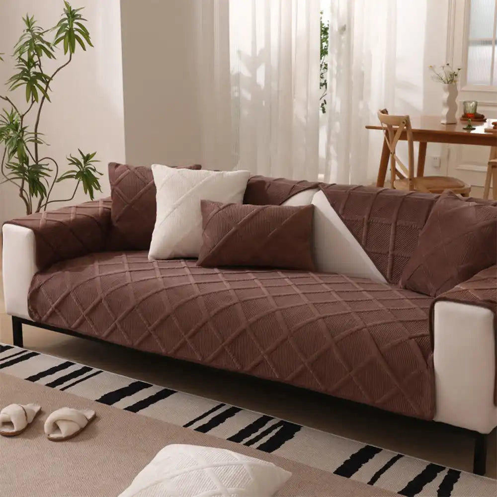 Detail of the anti-slip backing on a soft touch sofa protector, ensuring secure fit on furniture