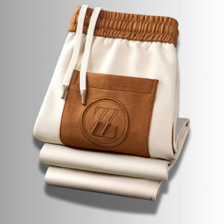 Moderner Herren Jogginganzug, atmungsaktiv, in Grau mit Kapuze und Taschen, ideal für Sport und Freizeit.