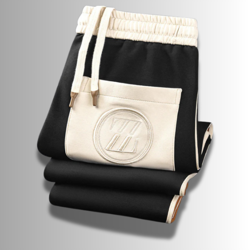 Moderner Herren Jogginganzug, atmungsaktiv, in Grau mit Kapuze und Taschen, ideal für Sport und Freizeit.