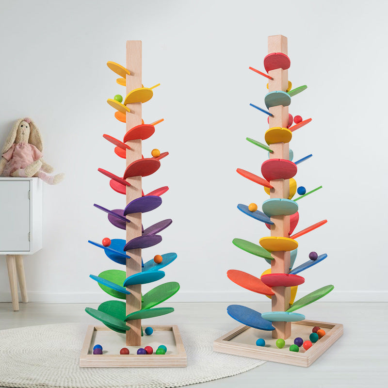 "Montessori Regenbogen Holzturm: Farbenfrohes Spielzeug mit rollenden Murmeln zur Förderung der motorischen Entwicklung."
