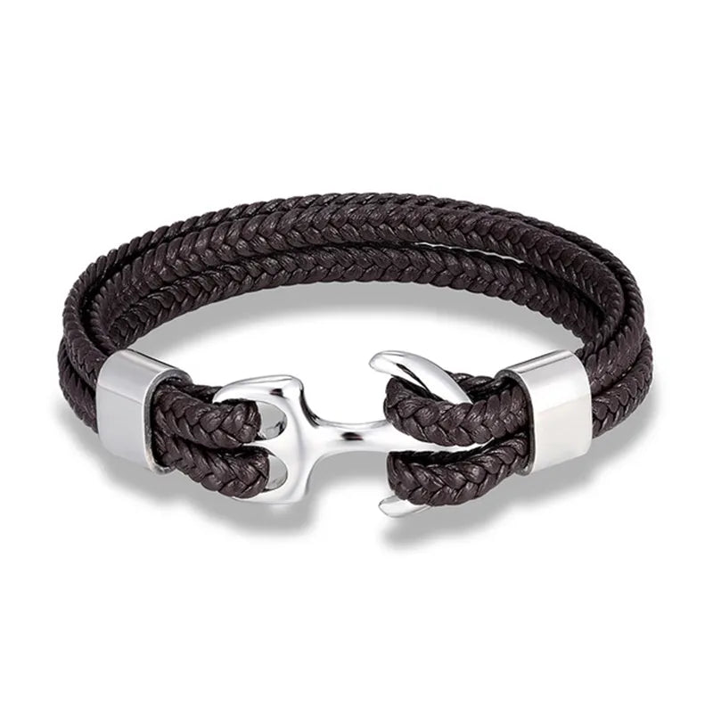 Close-up: Men's rugged brown leather bracelet with a detailed stainless steel anchor.