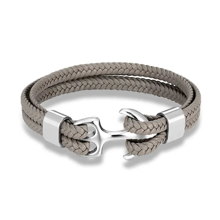 Men's rugged leather and anchor bracelet, adding a touch of nautical flair to his outfit.