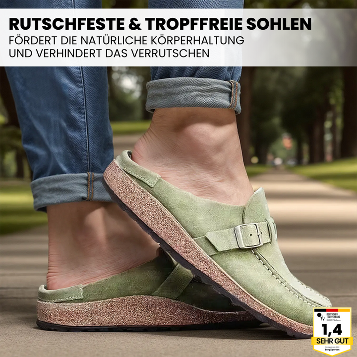 "Orthopädische Hausschuhe mit Wildleder und rutschfester Sohle, bieten Komfort und Fußunterstützung, elegant designt."