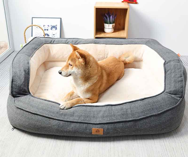 Orthopedic dog bed with washable cover, providing joint support for large dogs.