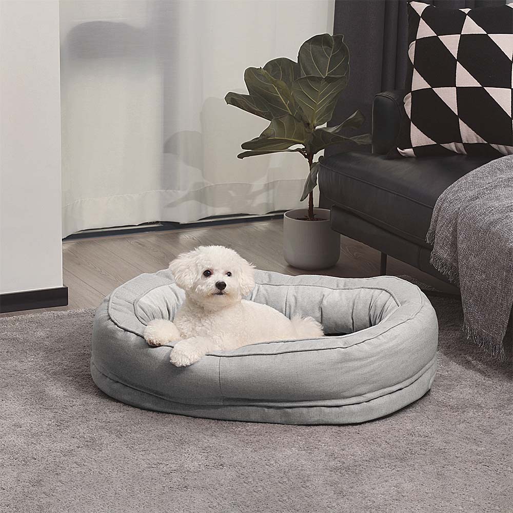 Grey orthopedic donut dog bed, a cozy pet bed for restful sleep.