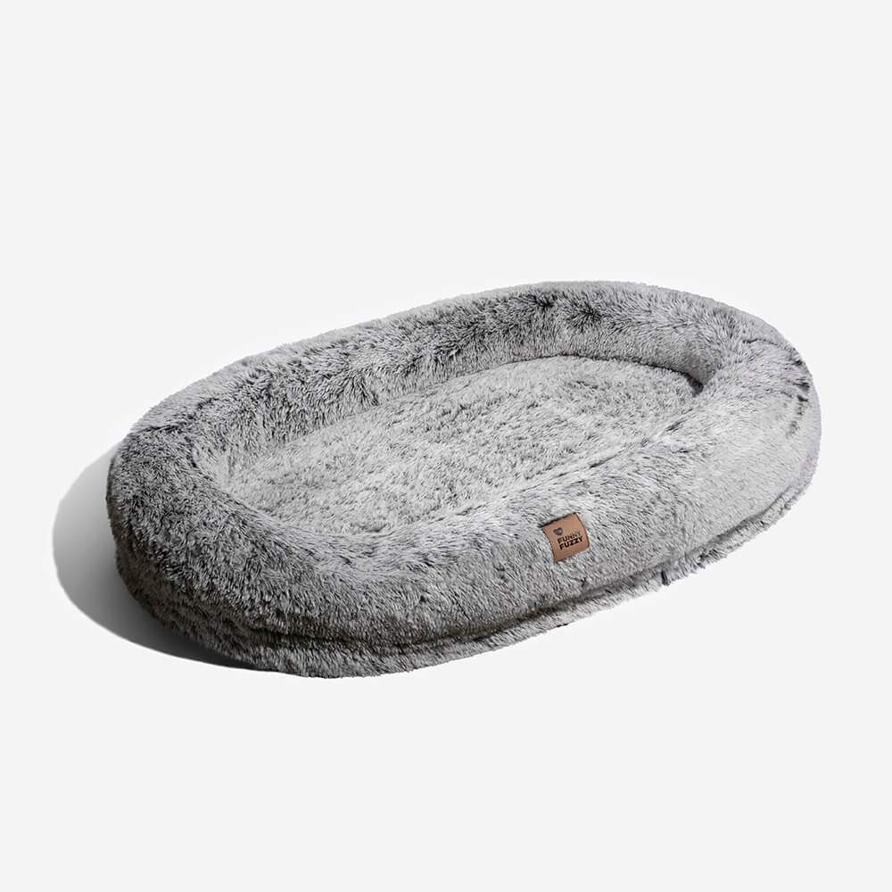 Orthopedic pet bed, donut-shaped, providing excellent support for hips and joints.
