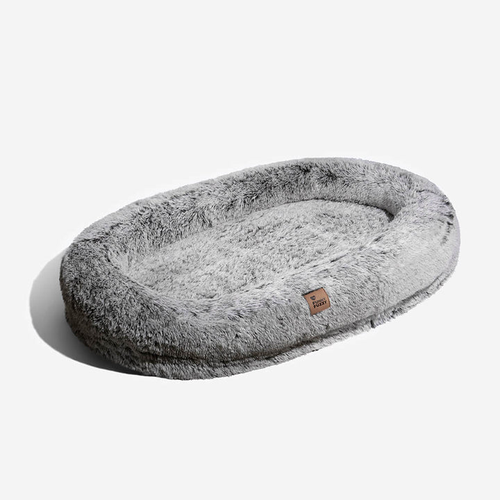 Orthopedic pet bed, donut-shaped, providing excellent support for hips and joints.
