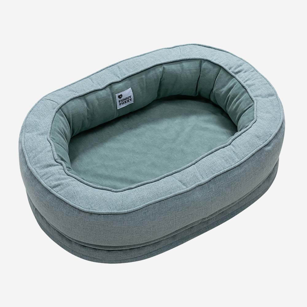 Donut-shaped orthopedic dog bed, providing a secure and cozy space for pets.
