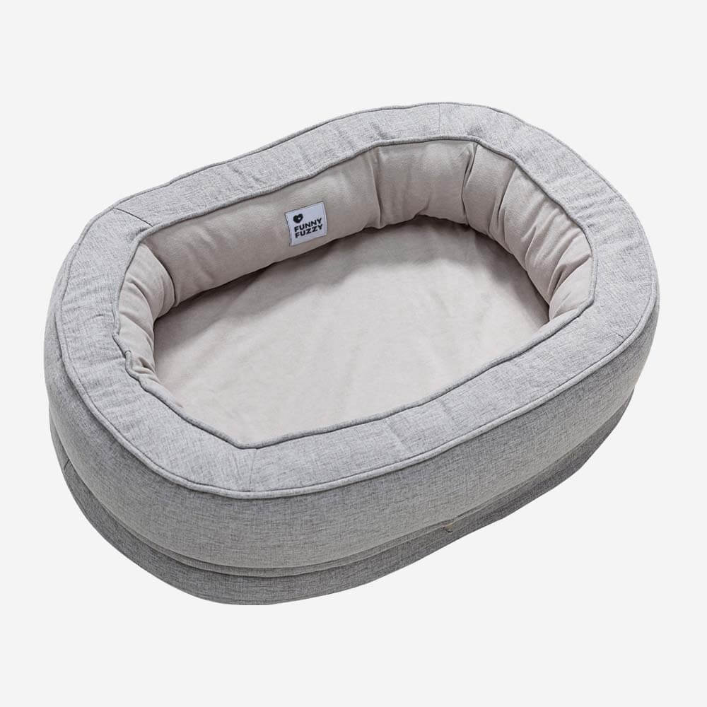 Orthopedic donut dog bed, featuring a raised rim for head and neck support.
