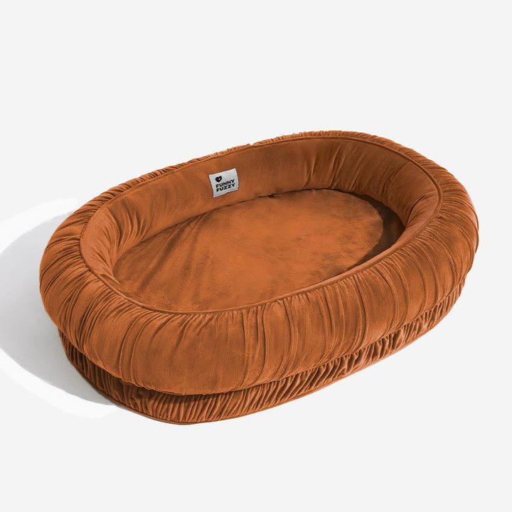 Durable pet supplies: calming orthopedic oval bed with a washable and removable velvet cover.