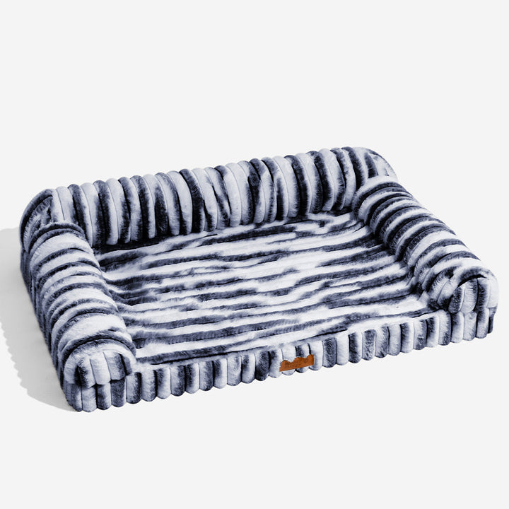Washable striped orthopedic pet bed with soft bolster, ideal for comfort & support, non-slip