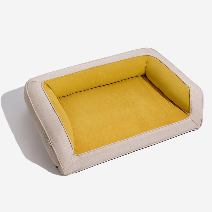Senior dog comfortably resting on a durable orthopedic pet bed, showing deep joint support.