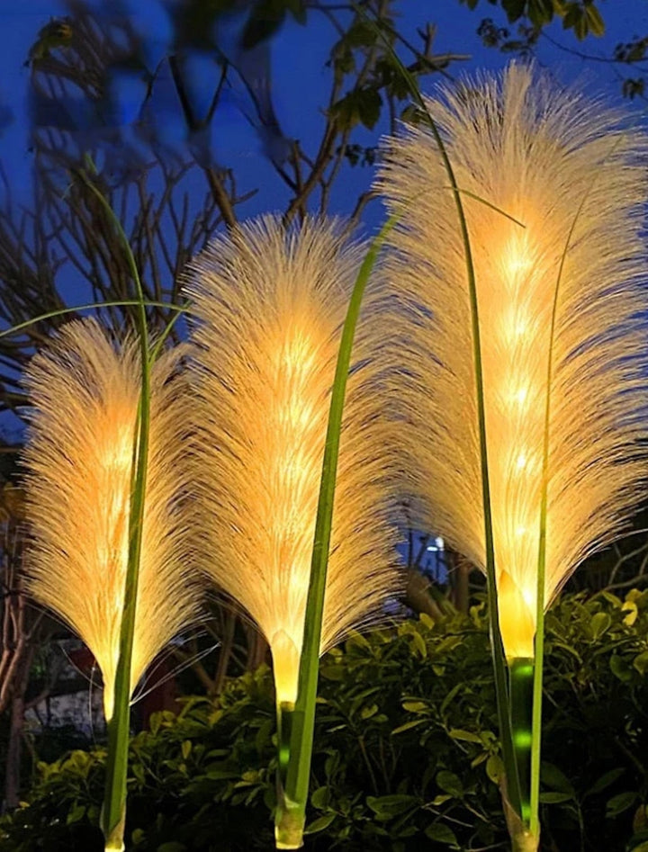 Outdoor solar decorative reed garden lights, providing eco-friendly pathway lighting for yards.