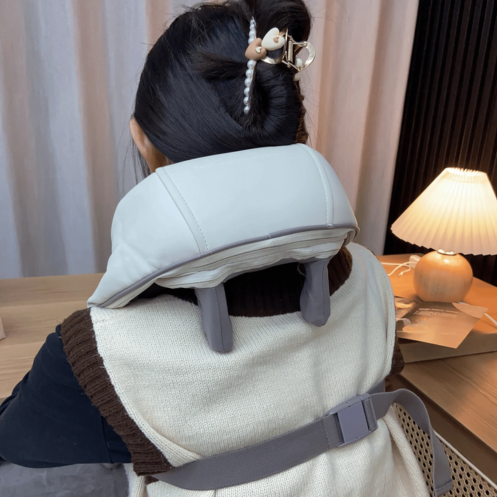 Wireless deep tissue neck and shoulder massager for pain and stress relief. Features soothing heat therapy.