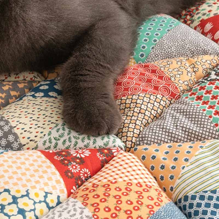 Stylish quilted cotton couch protector in green, pet-friendly, non-slip, enhancing home decor