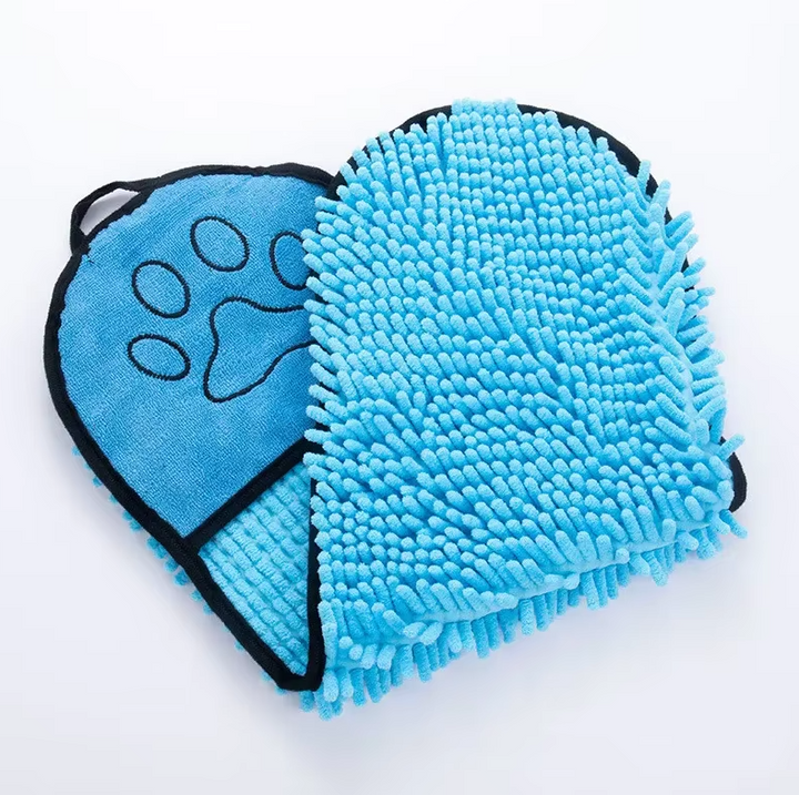 Dog enjoying quick dry with a gray microfiber pet towel and grooming glove after a swim