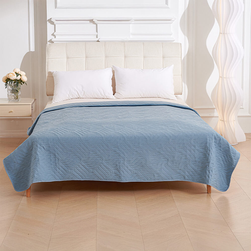 Water droplet beading on a Pet Proof Water-Resistant Bed Cover, demonstrating its urine-proof quality.