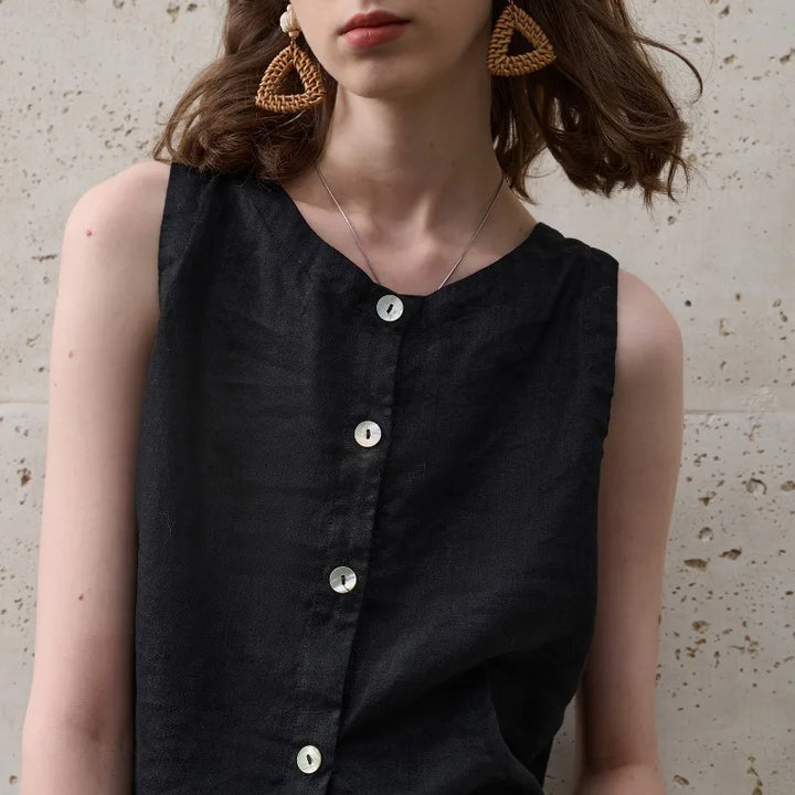 Chic women's asymmetric crop top in pink. Modern sleeveless design, great for stylish casual summer wear.