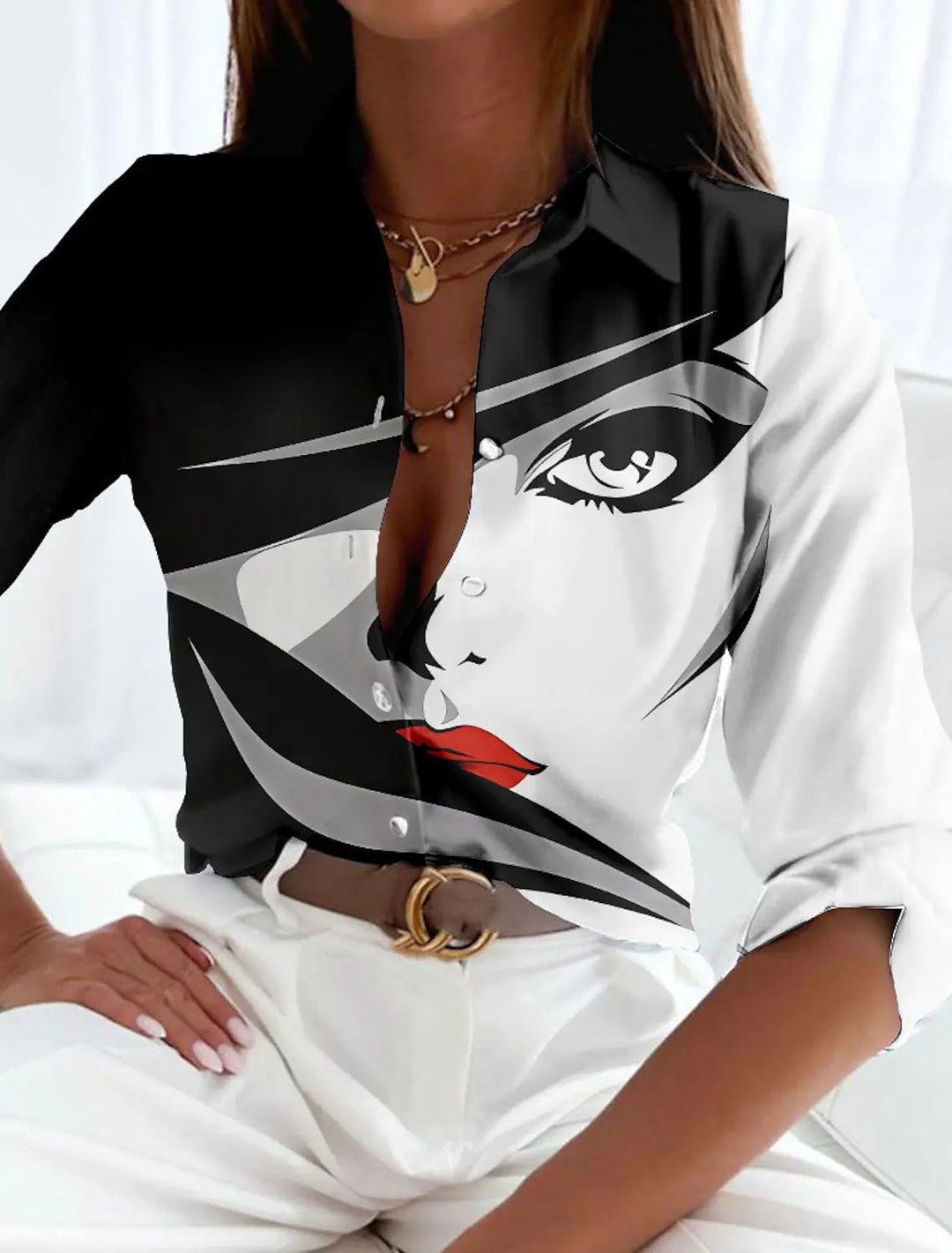 Comfortable plus size women's long-sleeve button-up shirt. Features a unique geometric pattern for a modern look.