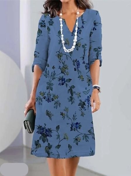 Vibrant floral plus size midi dress for women, featuring a flattering V-neck and short sleeves. Ideal casual summer wear.