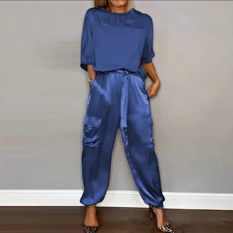 Stylish plus size women's cargo two-piece set featuring a utility top and drawstring waist pants. Casual & comfy.