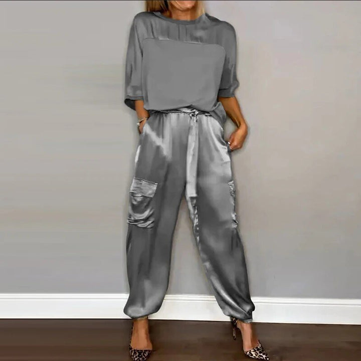 Plus size women's casual cargo two-piece set, featuring drawstring utility pants. Versatile fall/spring fashion.