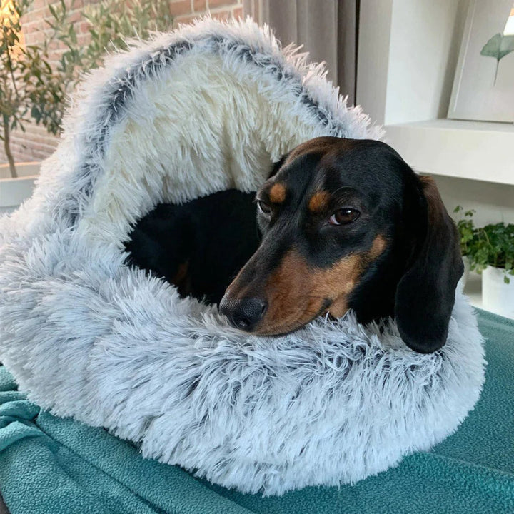 Grey calming cave dog bed. Washable plush pet bed for anxiety relief and deep sleep comfort.