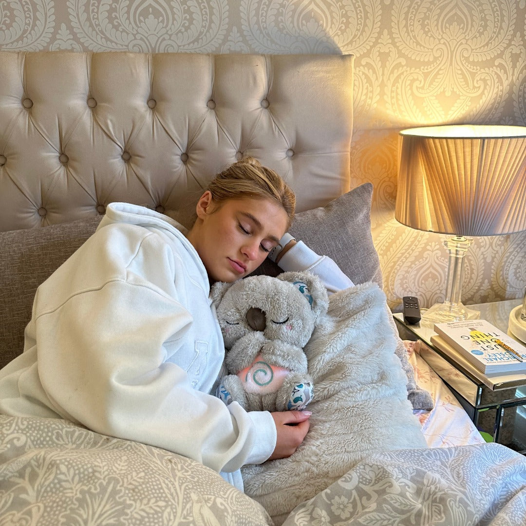 Plush calming koala breathing toy with gentle light, perfect for stress relief & relaxation.